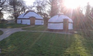 Yurts from washroom in sunlight